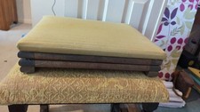 fold away footstool, beige fabric cover, wooden frame, some marks on fabric