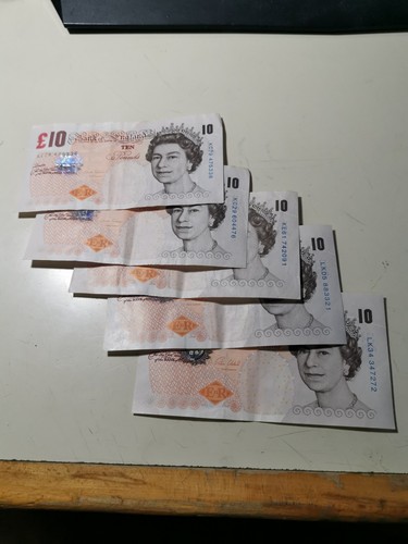 Old pound note and 1 - pound, x