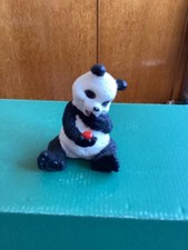 Panda holding a Ladybird