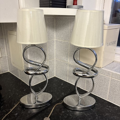 Pair chrome squiggle - of,