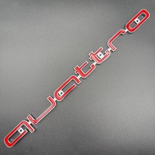 Red And Chrome Quattro Badge