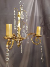 Pair of French antique brass double wall lights with crystal droplets. Rewired.