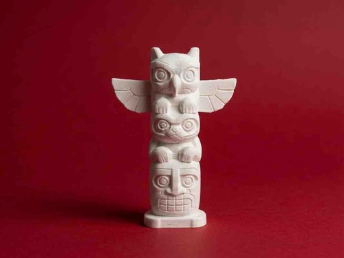 Carved animal totem pole - carved,