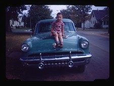 Red Boarder Boy Sitting on