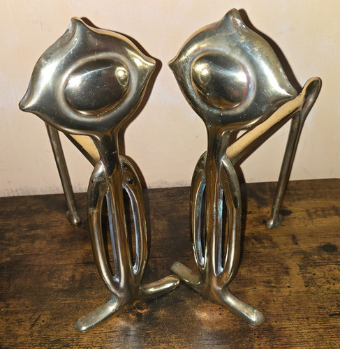 Pair brass art - a, of