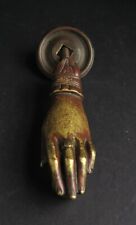 AN ORIGINAL PERIOD BRASS HAND OF FATIMA DOOR KNOCKER WITH ITS BACKPLATE