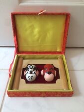 Miniature chinese opera masks in a frame and silk red box.