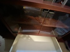 Corner TV Unit In Red Mahogany with glass doors and a drawer. 