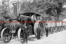 F000955 Photo of three men with a Burrell steam tractor and freight wagons 1906
