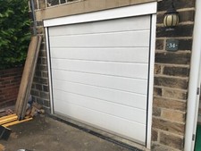 automatic roller garage door. Good condition and working. Buyer to Collect