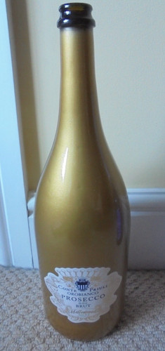 Empty gold coloured - empty, prosecco