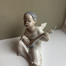 Lladro Black Angel Playing
