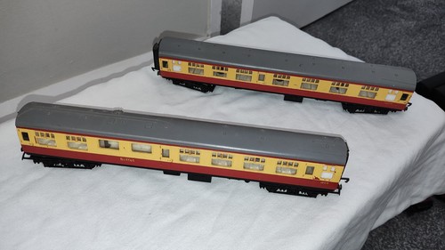 Two cream and maroon - maroon, coaches