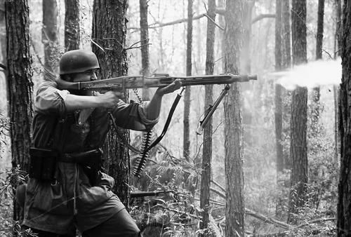 German paratrooper fires mg42 - german,