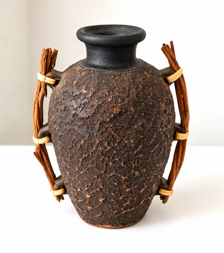 Brown black textured ceramic - &,
