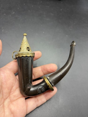 Old tobacco pipe with - tobacco, lid