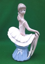 CASADES SEATED BALLERINA FIGURE.