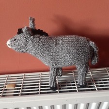 Newly hand knitted grey - hand,