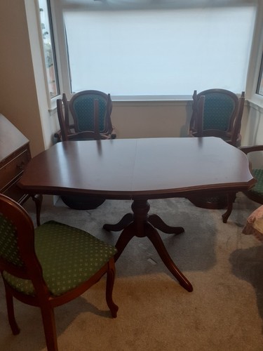 Extending wooden dining table