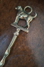 A brass toasting fork of fox