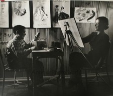 Woman artist by easel with boy posing antique photo