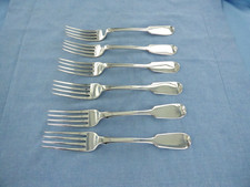 AN ANTIQUE STERLING SILVER SET OF SIX FIDDLE BACK DINNER FORKS, LONDON 1857.