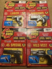 Collection Of 4 Super Bang Die cast metal Steel Shots Mini Cap Guns + 100 Caps