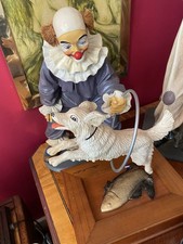 Jun Asilo Clown With Dog Jumping Through Hoop