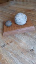 Stone Cannon Balls on a Wooden