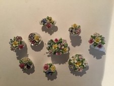 Royal Doulton miniture flower posies. 9 in total all but 1 in good condition.