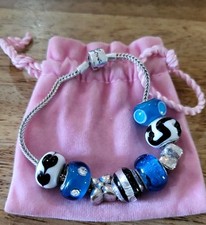 Rhona Sutton 925 silver charm bracelet x8