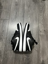 black-and-white low-top Nike