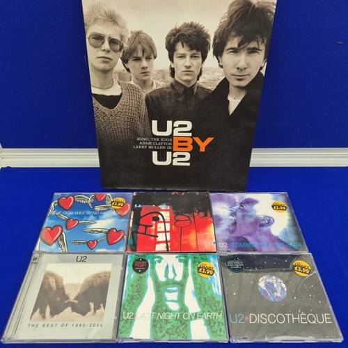 Cds and book by - u2, u2