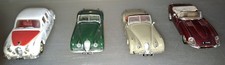 CORGI TOYS - FOUR DIE-CAST JAGUARS, ALL DIFFERENT