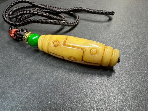 Hand carved camel - bone, dzi