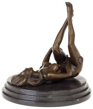 A bronze sculpture of a female