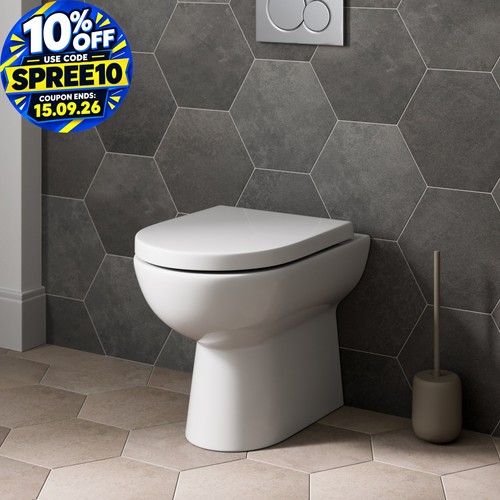 Back wall btw toilet pan - back,