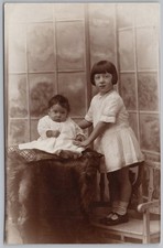 NELSON Lancs, Girl with infant RP Postcard by J. Harrison of Pendle St