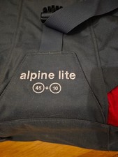 karrimor backpack . Grey and red. Used, looks new .