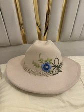 Cream Cowboy Hat With Flower Motive ? on front & either side?