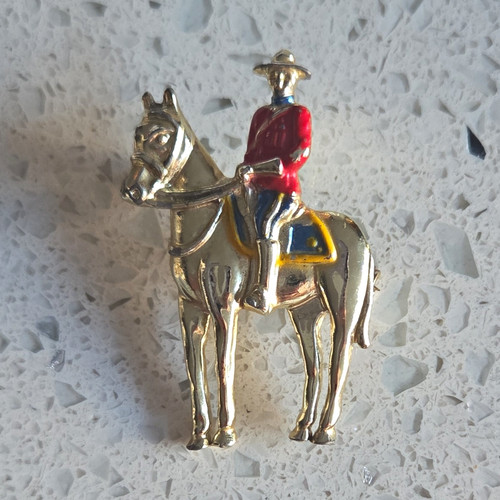 Gold tone metal - metal, rider