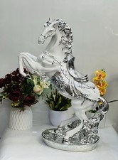 White & Silver Jumping Horse