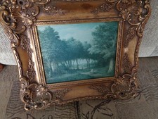 vintage old painting in wooden guilt frame in the style of R Cavalla