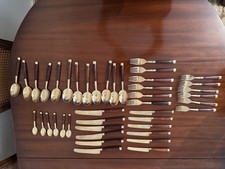 Bronze Coloured Cutlery Set with Wooden Handles for 6 People .