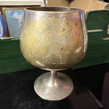 vintage metal goblet featuring
