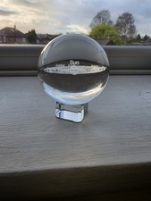 3D laser-engraved crystal ball depicting the solar system.