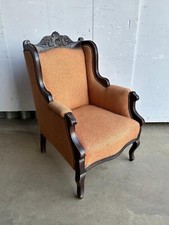 A late Victorian mahogany wing armchair