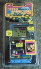 SUPER BREAKOUT ATARI MGA HANDHELD LCD MINI CABINET GAME 2005 NEW OLD STOCK