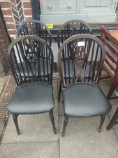4 Oak wheel back spindle back dining chairs