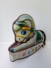 Tin toy. Clockwork Rocking